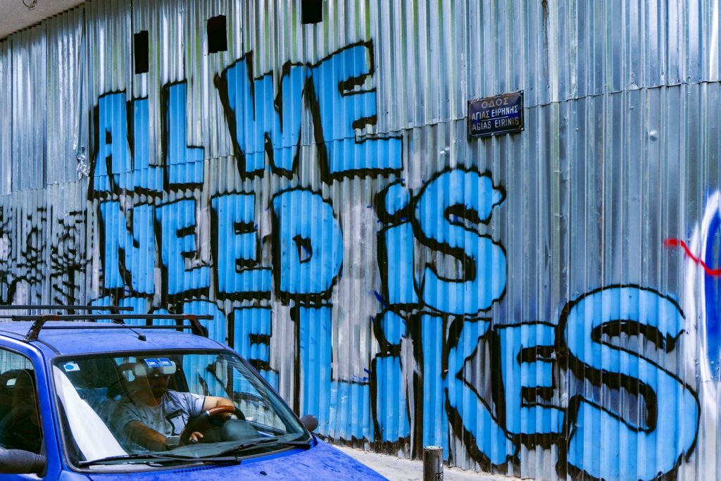'All we need is likes' graffiti
